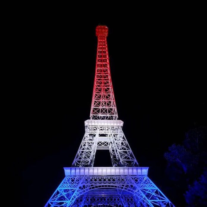 Eiffel Tower lit up red, white, and blue in Paris, TN